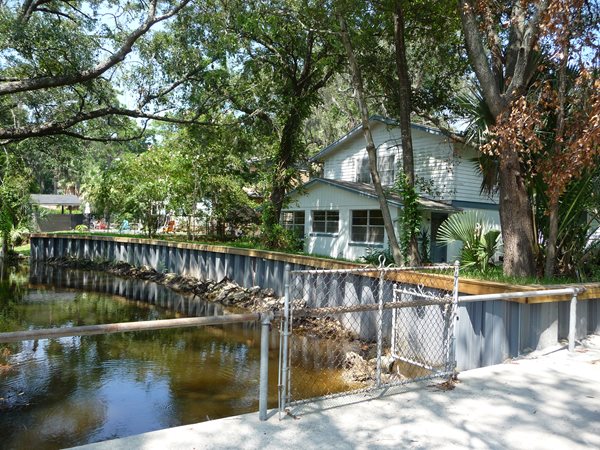 Mitigation wall protecting home from flood waters.